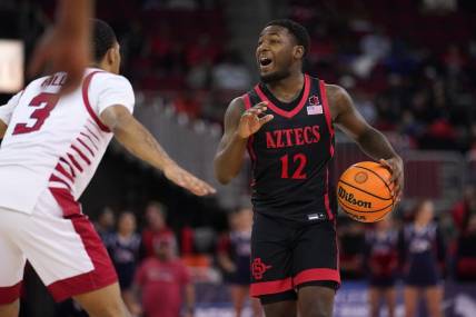 Feb 15, 2023; Fresno, California, USA; San Diego State Aztecs guard Darrion Trammell (12) dribbles the ball against the Fresno State Bulldogs in the first half at the Save Mart Center. Mandatory Credit: Cary Edmondson-USA TODAY Sports