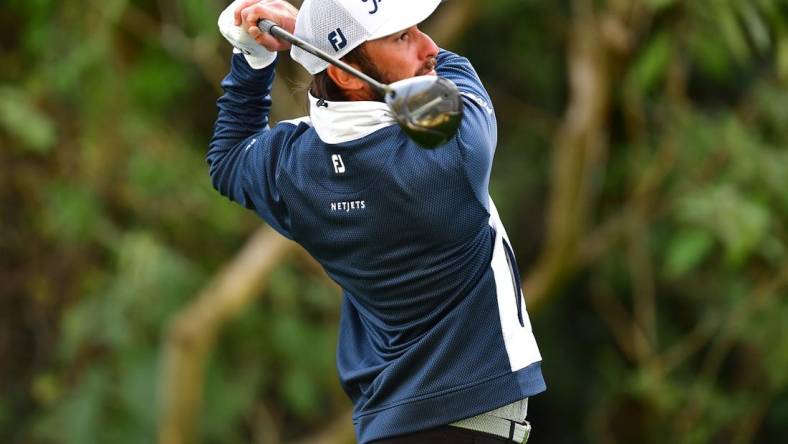 Feb 16, 2023; Pacific Palisades, California, USA; Max Homa hits from the twelfth hole tee during the first round of The Genesis Invitational golf tournament. Mandatory Credit: Gary A. Vasquez-USA TODAY Sports