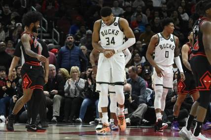 Feb 16, 2023; Chicago, Illinois, USA;  Milwaukee Bucks forward Giannis Antetokounmpo (34) holds his wrist after colliding with Chicago Bulls guard Coby White (not pictured) during the first half at the United Center. Mandatory Credit: Matt Marton-USA TODAY Sports