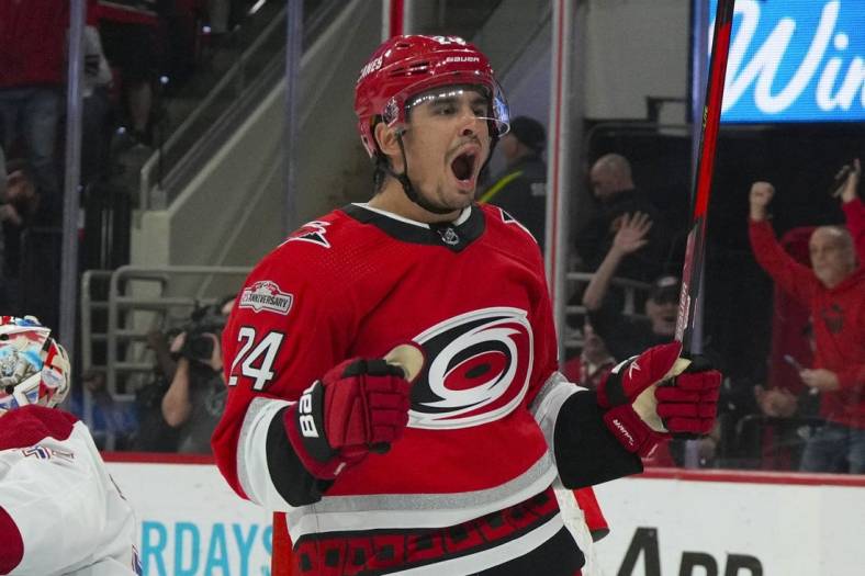 Feb 16, 2023; Raleigh, North Carolina, USA;  Carolina Hurricanes center Seth Jarvis (24) celebrates his goal against the Montreal Canadiens during the first period at PNC Arena. Mandatory Credit: James Guillory-USA TODAY Sports