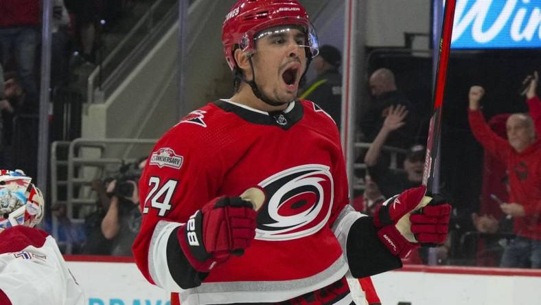 Feb 16, 2023; Raleigh, North Carolina, USA;  Carolina Hurricanes center Seth Jarvis (24) celebrates his goal against the Montreal Canadiens during the first period at PNC Arena. Mandatory Credit: James Guillory-USA TODAY Sports