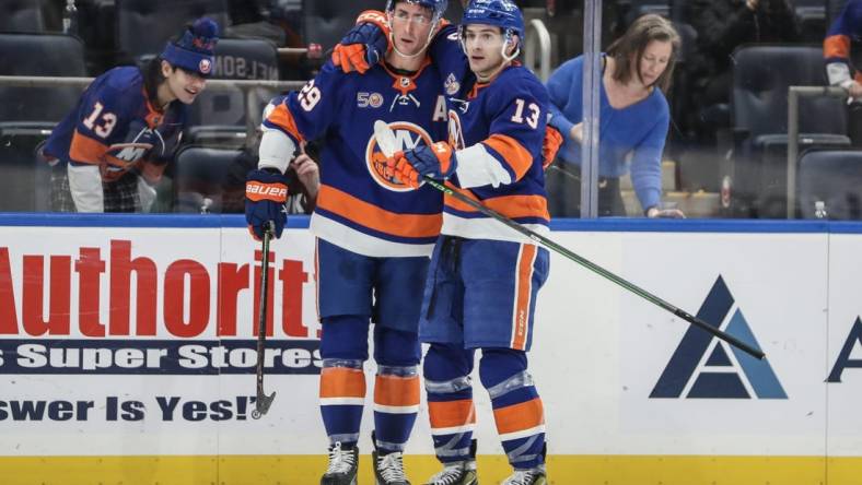 Feb 17, 2023; Elmont, New York, USA;  New York Islanders center Brock Nelson (29) celebrates with center Mathew Barzal (13) after scoring a goal in the second period against the Pittsburgh Penguins at UBS Arena. Mandatory Credit: Wendell Cruz-USA TODAY Sports