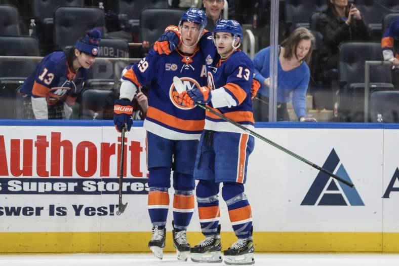 Feb 17, 2023; Elmont, New York, USA;  New York Islanders center Brock Nelson (29) celebrates with center Mathew Barzal (13) after scoring a goal in the second period against the Pittsburgh Penguins at UBS Arena. Mandatory Credit: Wendell Cruz-USA TODAY Sports