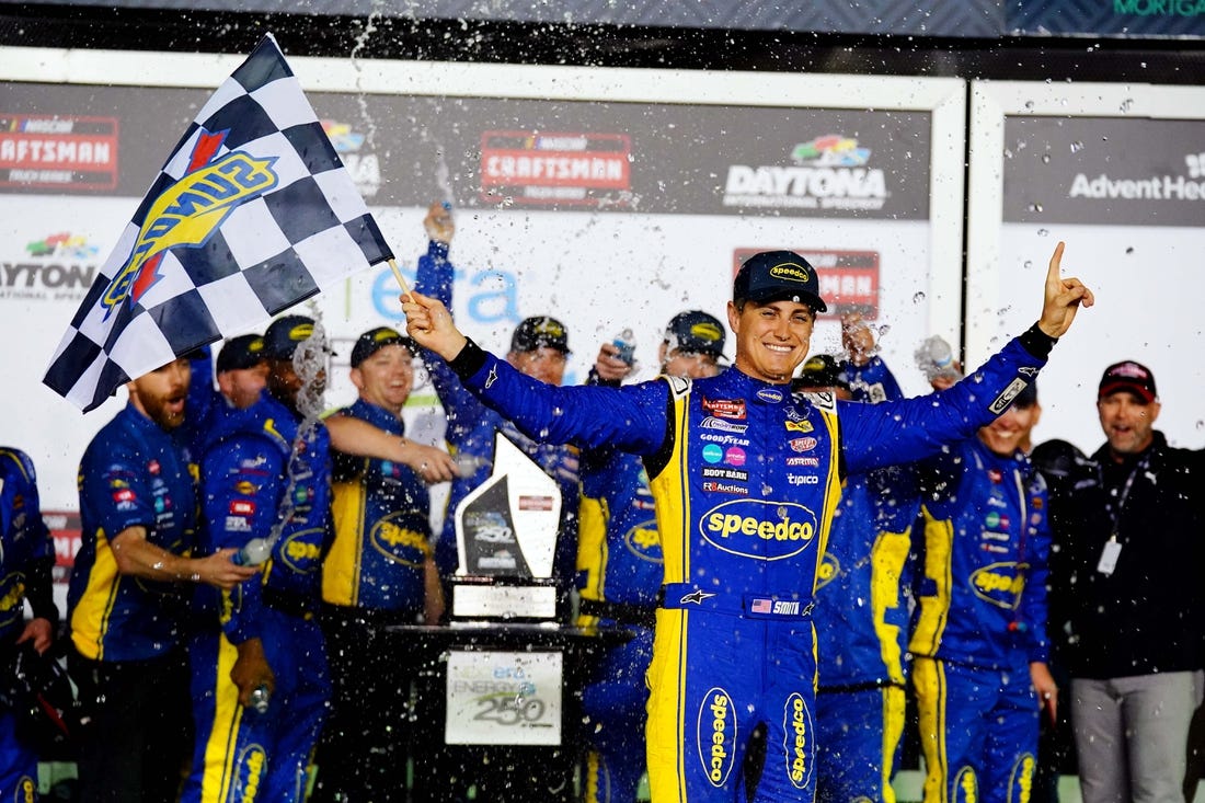 Feb 17, 2023; Daytona Beach, Florida, USA; NASCAR Truck Series driver Zane Smith (38) celebrates in victory lane after being declared the winner following a rain shortened NextEra Energy 250 race at Daytona International Speedway. Mandatory Credit: John David Mercer-USA TODAY Sports