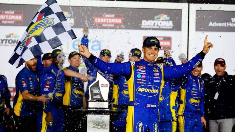 Feb 17, 2023; Daytona Beach, Florida, USA; NASCAR Truck Series driver Zane Smith (38) celebrates in victory lane after being declared the winner following a rain shortened NextEra Energy 250 race at Daytona International Speedway. Mandatory Credit: John David Mercer-USA TODAY Sports