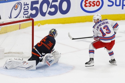 Feb 17, 2023; Edmonton, Alberta, CAN; New York Rangers forward Alexis Lafreniere (13) scores the shoot-out winning goal against Edmonton Oilers goaltender Jack Campbell (36)  at Rogers Place. Mandatory Credit: Perry Nelson-USA TODAY Sports