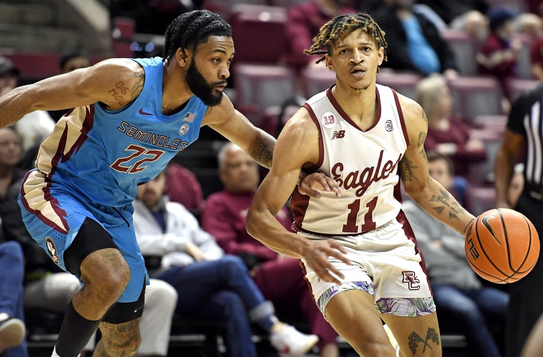 Feb 18, 2023; Tallahassee, Florida, USA; Boston College Eagles guard Makai Ashton-Langford (11) drives to the net past Florida State Seminoles guard Darin Green Jr (22) during the first half at Donald L. Tucker Center. Mandatory Credit: Melina Myers-USA TODAY Sports