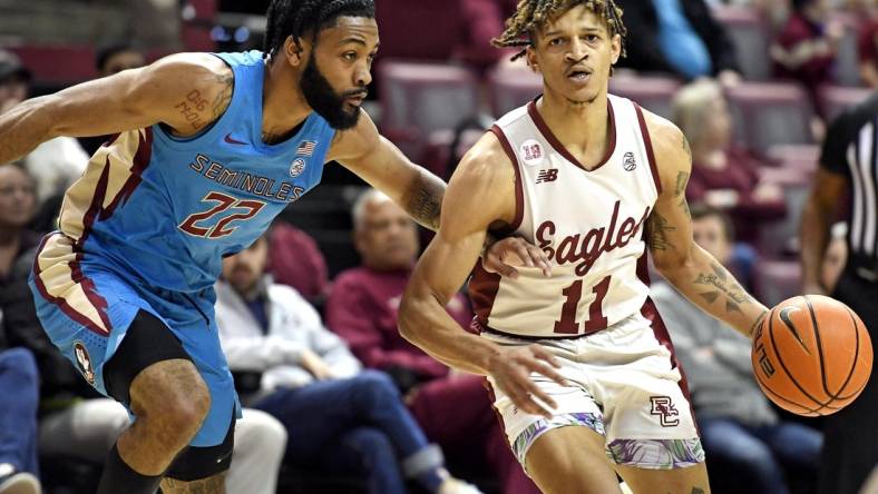 Feb 18, 2023; Tallahassee, Florida, USA; Boston College Eagles guard Makai Ashton-Langford (11) drives to the net past Florida State Seminoles guard Darin Green Jr (22) during the first half at Donald L. Tucker Center. Mandatory Credit: Melina Myers-USA TODAY Sports