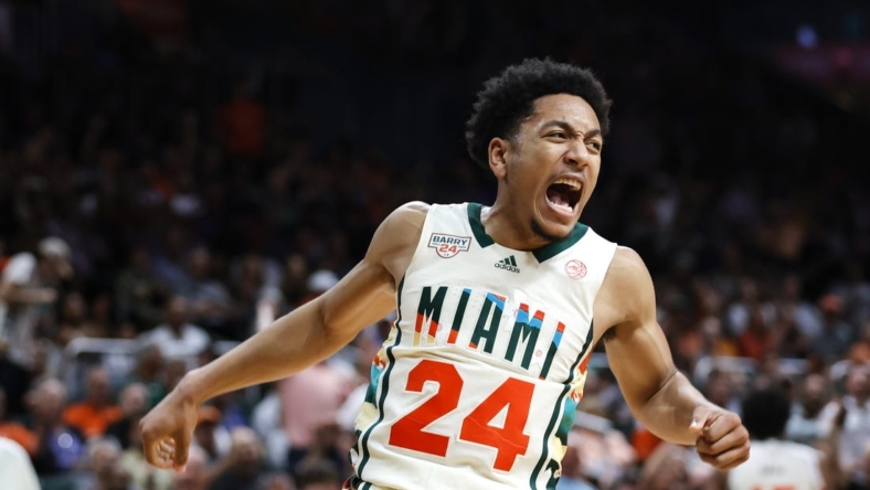 Feb 18, 2023; Coral Gables, Florida, USA; Miami Hurricanes guard Nijel Pack (24) reacts after dunking the basketball against the Wake Forest Demon Deacons during the second half at Watsco Center. Mandatory Credit: Sam Navarro-USA TODAY Sports