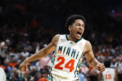 Feb 18, 2023; Coral Gables, Florida, USA; Miami Hurricanes guard Nijel Pack (24) reacts after dunking the basketball against the Wake Forest Demon Deacons during the second half at Watsco Center. Mandatory Credit: Sam Navarro-USA TODAY Sports