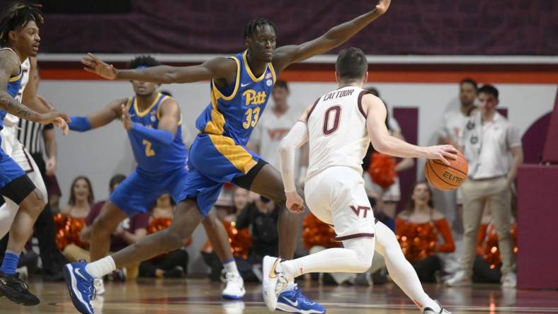 Feb 18, 2023; Blacksburg, Virginia, USA; Virginia Tech Hokies guard Sean Pedulla (3) dribbles around Pittsburgh Panthers center Federiko Federiko (33) in the first half at Cassell Coliseum. Mandatory Credit: Lee Luther Jr.-USA TODAY Sports