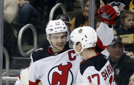Feb 18, 2023; Pittsburgh, Pennsylvania, USA;  New Jersey Devils center Nico Hischier (13) celebrates with center Yegor Sharangovich (17) after Hischier scored a goal against the Pittsburgh Penguins during the second period at PPG Paints Arena. Mandatory Credit: Charles LeClaire-USA TODAY Sports
