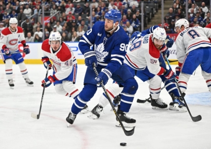Feb 18, 2023; Toronto, Ontario, CAN;   Toronto Maple Leafs forward Ryan O'Reilly (90) looks for a passing option against the Montreal Canadiens in the first period at Scotiabank Arena. Mandatory Credit: Dan Hamilton-USA TODAY Sports