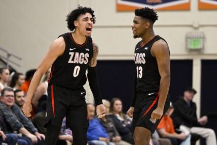 Feb 18, 2023; Malibu, California, USA; Gonzaga Bulldogs guard Julian Strawther (0) celebrates with guard Malachi Smith (13) after making a shot while being fouled against the Pepperdine Waves during the first half at Firestone Fieldhouse. Mandatory Credit: Kelvin Kuo-USA TODAY Sports