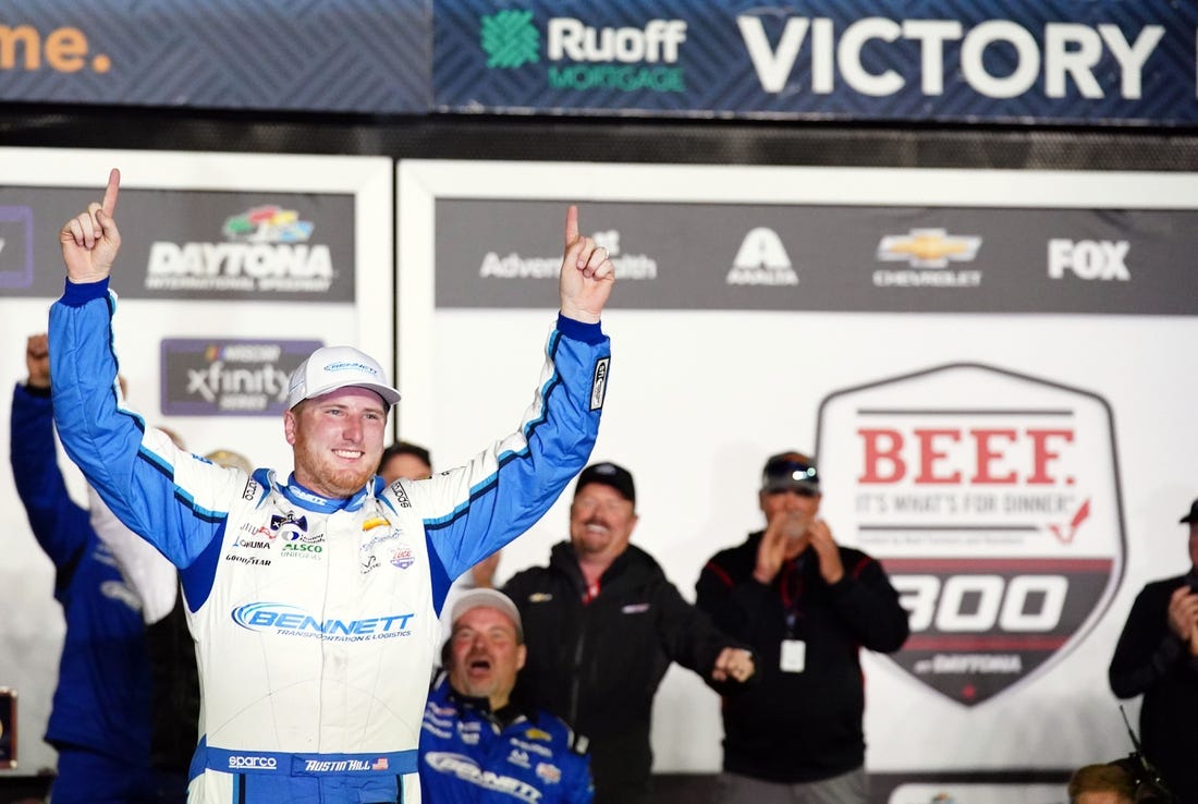 Feb 18, 2023; Daytona Beach, Florida, USA; Xfinity Series driver Austin Hill (21) celebrates in victory lane after winning the Beef It's What's For Dinner 300 race at Daytona International Speedway. Mandatory Credit: John David Mercer-USA TODAY Sports