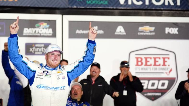 Feb 18, 2023; Daytona Beach, Florida, USA; Xfinity Series driver Austin Hill (21) celebrates in victory lane after winning the Beef It's What's For Dinner 300 race at Daytona International Speedway. Mandatory Credit: John David Mercer-USA TODAY Sports