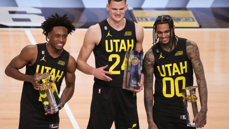 Feb 18, 2023; Salt Lake City, UT, USA; Team Jazz guard Collin Sexton (2), center Walker Kessler (24) and guard Jordan Clarkson (00) pose for a photo with their trophies after winning the Skills Competition during the 2023 All Star Saturday Night at Vivint Arena. Mandatory Credit: Kirby Lee-USA TODAY Sports