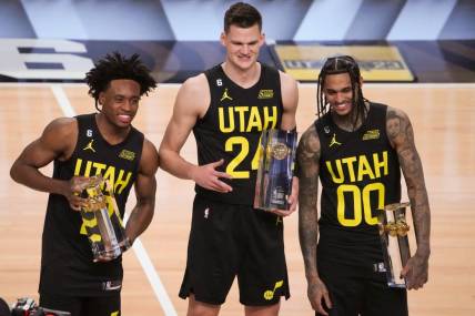 Feb 18, 2023; Salt Lake City, UT, USA; Team Jazz guard Collin Sexton (2), center Walker Kessler (24) and guard Jordan Clarkson (00) pose for a photo with their trophies after winning the Skills Competition during the 2023 All Star Saturday Night at Vivint Arena. Mandatory Credit: Kirby Lee-USA TODAY Sports