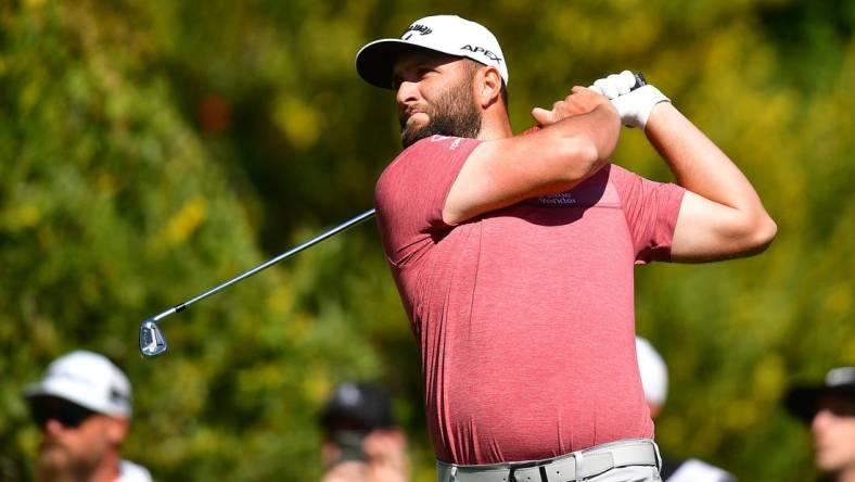 Feb 19, 2023; Pacific Palisades, California, USA; Jon Rahm hits from the fourth hole tee during the final round of The Genesis Invitational golf tournament. Mandatory Credit: Gary A. Vasquez-USA TODAY Sports