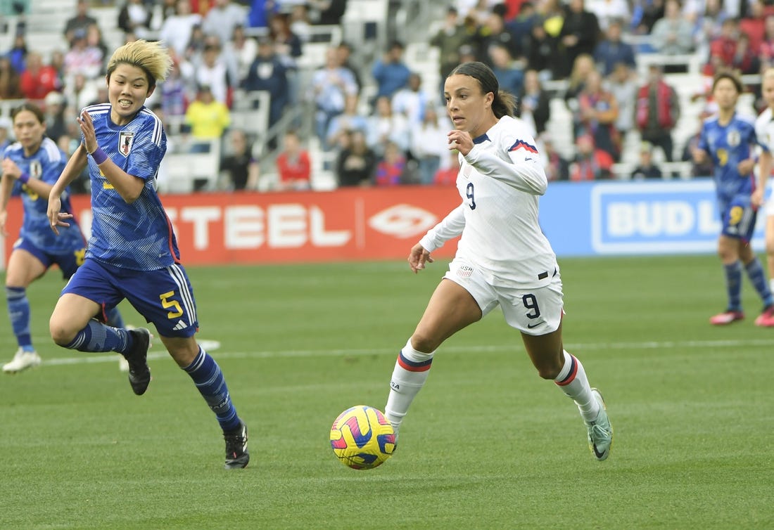 Feb 19, 2023; Nashville, Tennessee, USA;  United States of America forward Mallory Swanson (9) dribbles against the Japan during the first half at Geodis Park. Mandatory Credit: Steve Roberts-USA TODAY Sports