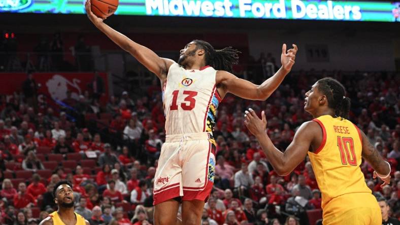 Feb 19, 2023; Lincoln, Nebraska, USA; Nebraska Cornhuskers forward Derrick Walker (13) reaches for a loose ball against Maryland Terrapins forward Julian Reese (10) in the first half at Pinnacle Bank Arena. Mandatory Credit: Steven Branscombe-USA TODAY Sports