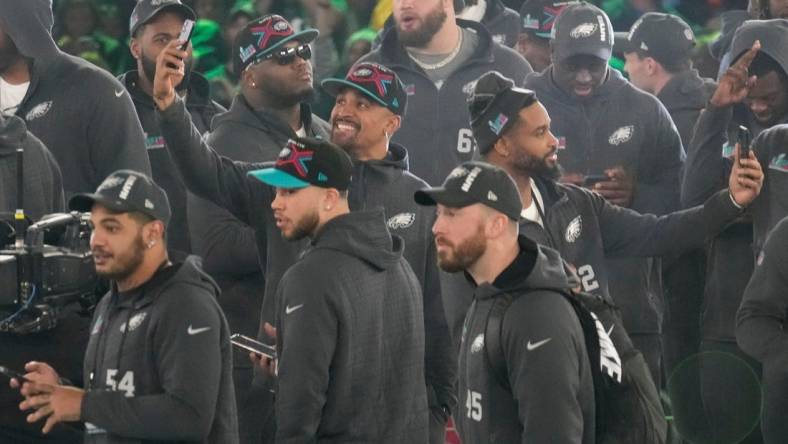 Philadelphia Eagles quarterback Jalen Hurts takes a picture on stage at the Footprint Center in downtown Phoenix during the NFL's Super Bowl Opening Night on Feb. 6, 2023.

Nfl Super Bowl Opening Night At Footprint Center