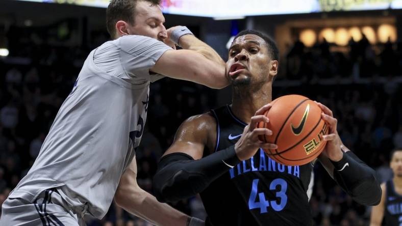 Feb 21, 2023; Cincinnati, Ohio, USA;  Xavier Musketeers forward Jack Nunge (24) defends against Villanova Wildcats forward Eric Dixon (43) in the second half at the Cintas Center. Mandatory Credit: Aaron Doster-USA TODAY Sports