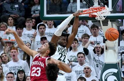 Feb 21, 2023; East Lansing, Michigan, USA; Michigan State Spartans center Mady Sissoko (22) dunks the ball past Indiana Hoosiers forward Trayce Jackson-Davis (23) in the first half at Jack Breslin Student Events Center. Mandatory Credit: Dale Young-USA TODAY Sports