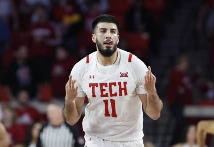 Feb 21, 2023; Norman, Oklahoma, USA; Texas Tech Red Raiders forward Fardaws Aimaq (11) gestures after scoring a three point basket against the Oklahoma Sooners during the second half at Lloyd Noble Center. Texas Tech won 74-63. Mandatory Credit: Alonzo Adams-USA TODAY Sports