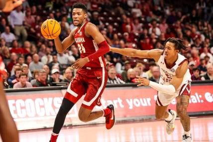 Feb 22, 2023; Columbia, South Carolina, USA; Alabama Crimson Tide forward Brandon Miller (24) drives around South Carolina Gamecocks guard Meechie Johnson (5) in the first half at Colonial Life Arena. Mandatory Credit: Jeff Blake-USA TODAY Sports