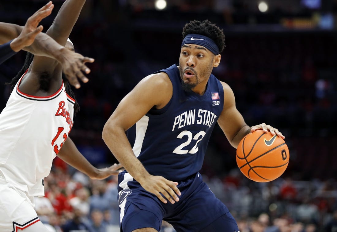 Feb 23, 2023; Columbus, Ohio, USA; Penn State Nittany Lions guard Jalen Pickett (22) dribbles past Ohio State Buckeyes guard Isaac Likekele (13) during the first half at Value City Arena. Mandatory Credit: Joseph Maiorana-USA TODAY Sports