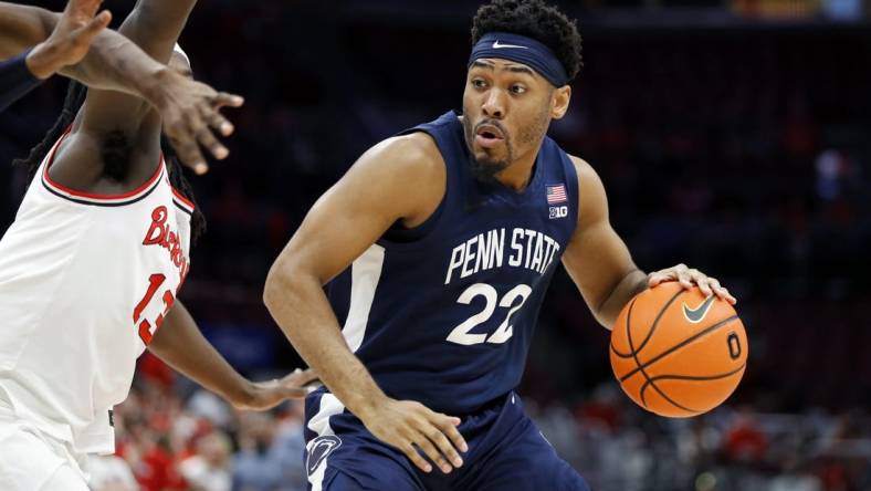 Feb 23, 2023; Columbus, Ohio, USA; Penn State Nittany Lions guard Jalen Pickett (22) dribbles past Ohio State Buckeyes guard Isaac Likekele (13) during the first half at Value City Arena. Mandatory Credit: Joseph Maiorana-USA TODAY Sports