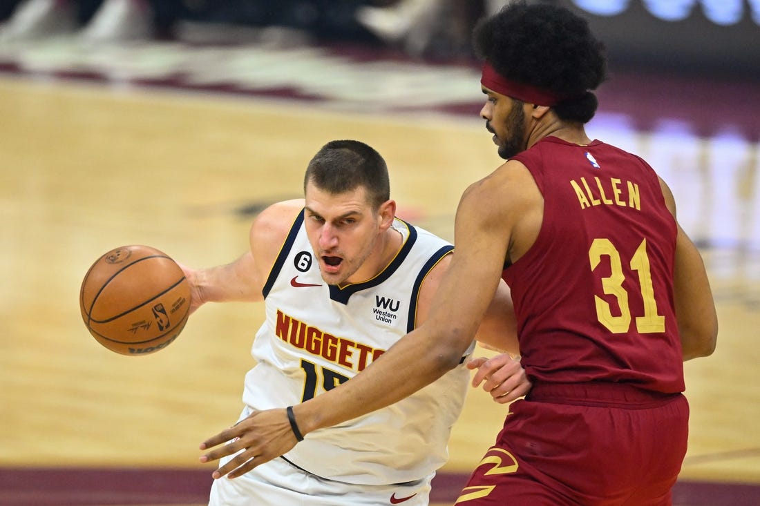 Feb 23, 2023; Cleveland, Ohio, USA; Denver Nuggets center Nikola Jokic (15) fights for position against Cavaliers center Jarrett Allen (31) in the first quarter at Rocket Mortgage FieldHouse. Mandatory Credit: David Richard-USA TODAY Sports