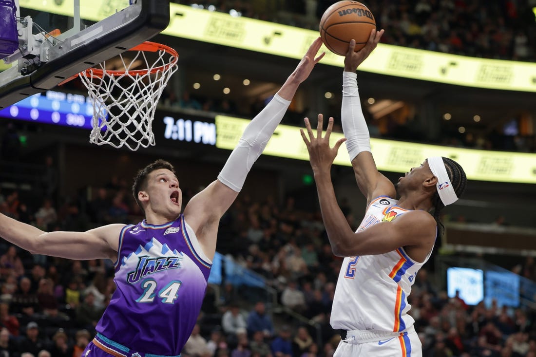 Feb 23, 2023; Salt Lake City, Utah, USA; Utah Jazz center Walker Kessler (24) blocks the shot of Oklahoma City Thunder guard Shai Gilgeous-Alexander (2) during the first quarter at Vivint Arena. Mandatory Credit: Chris Nicoll-USA TODAY Sports