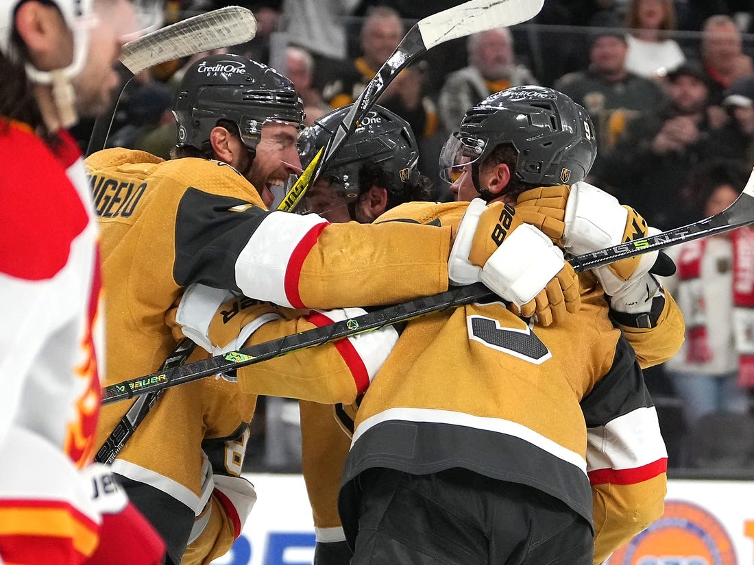 Vegas Golden Knights defenseman Alec Martinez, center, celebrates his goal  with center Jack Eichel, left, left wing William Carrier, second right, and  defenseman Alex Pietrangelo (7) during the second period in Game