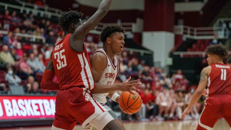 Feb 23, 2023; Stanford, California, USA;  Stanford Cardinal forward Harrison Ingram (55) drive to the net against Washington State Cougars forward Mouhamed Gueye (35) during the first half at Maples Pavilion. Mandatory Credit: Neville E. Guard-USA TODAY Sports