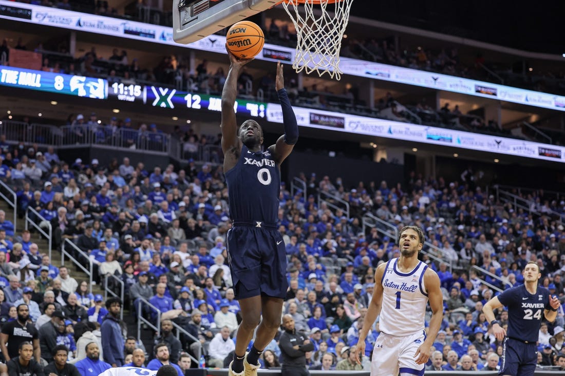 Feb 24, 2023; Newark, New Jersey, USA; Xavier Musketeers guard Souley Boum (0) shoots the ball in front of Seton Hall Pirates forward Tray Jackson (1) during the first half at Prudential Center. Mandatory Credit: Vincent Carchietta-USA TODAY Sports