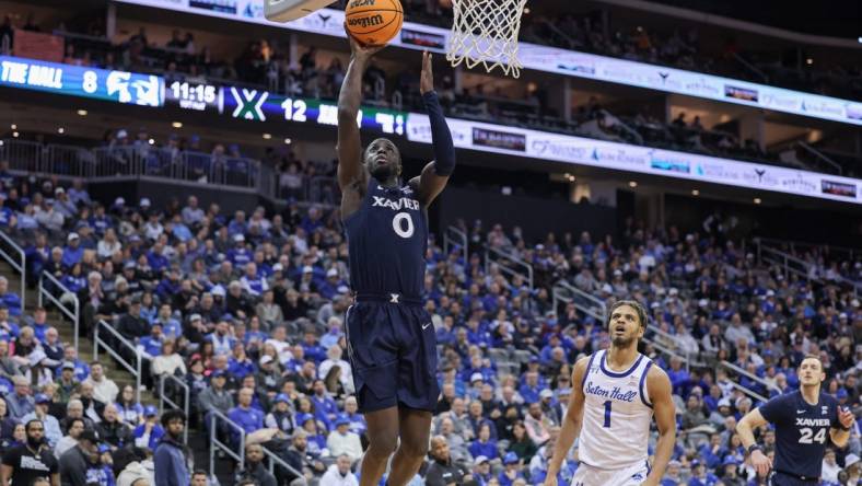 Feb 24, 2023; Newark, New Jersey, USA; Xavier Musketeers guard Souley Boum (0) shoots the ball in front of Seton Hall Pirates forward Tray Jackson (1) during the first half at Prudential Center. Mandatory Credit: Vincent Carchietta-USA TODAY Sports