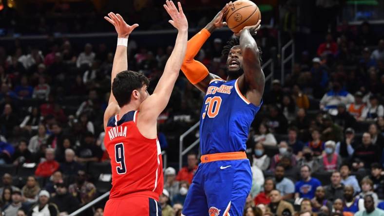 Feb 24, 2023; Washington, District of Columbia, USA; New York Knicks forward Julius Randle (30) shoots over Washington Wizards forward Deni Avdija (9) during the first half at Capital One Arena. Mandatory Credit: Brad Mills-USA TODAY Sports