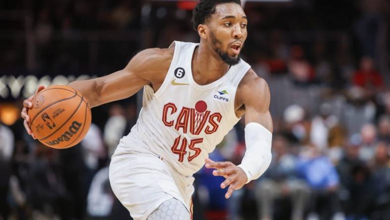 Feb 24, 2023; Atlanta, Georgia, USA; Cleveland Cavaliers guard Donovan Mitchell (45) dribbles against the Atlanta Hawks in the first quarter at State Farm Arena. Mandatory Credit: Brett Davis-USA TODAY Sports