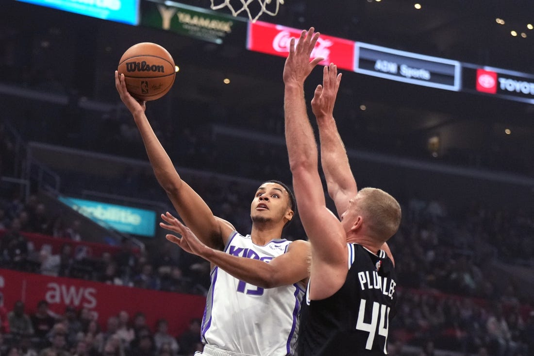 Feb 24, 2023; Los Angeles, California, USA; Sacramento Kings forward Keegan Murray (13) shoots the ball against LA Clippers center Mason Plumlee (44) in the first half at Crypto.com Arena. Mandatory Credit: Kirby Lee-USA TODAY Sports