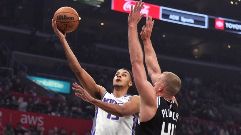 Feb 24, 2023; Los Angeles, California, USA; Sacramento Kings forward Keegan Murray (13) shoots the ball against LA Clippers center Mason Plumlee (44) in the first half at Crypto.com Arena. Mandatory Credit: Kirby Lee-USA TODAY Sports