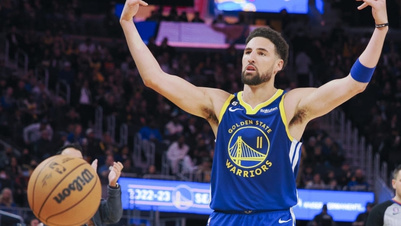 Feb 24, 2023; San Francisco, California, USA; Golden State Warriors guard Klay Thompson (11) gestures towards fans as a time out if called during the fourth quarter against the Houston Rockets at Chase Center. Mandatory Credit: Kelley L Cox-USA TODAY Sports