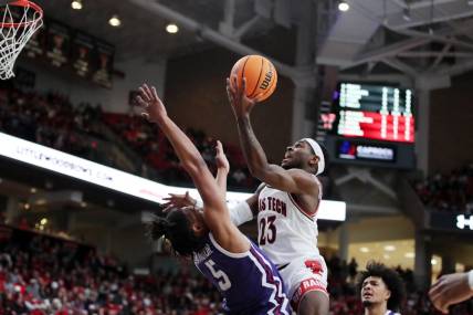 Feb 25, 2023; Lubbock, Texas, USA; Texas Tech Red Raiders guard De   Vion Harmon (23) drives to the basket against TCU Horned Frogs forward Chuck O   Bannon Jr. (5) in the first half at United Supermarkets Arena. Mandatory Credit: Michael C. Johnson-USA TODAY Sports