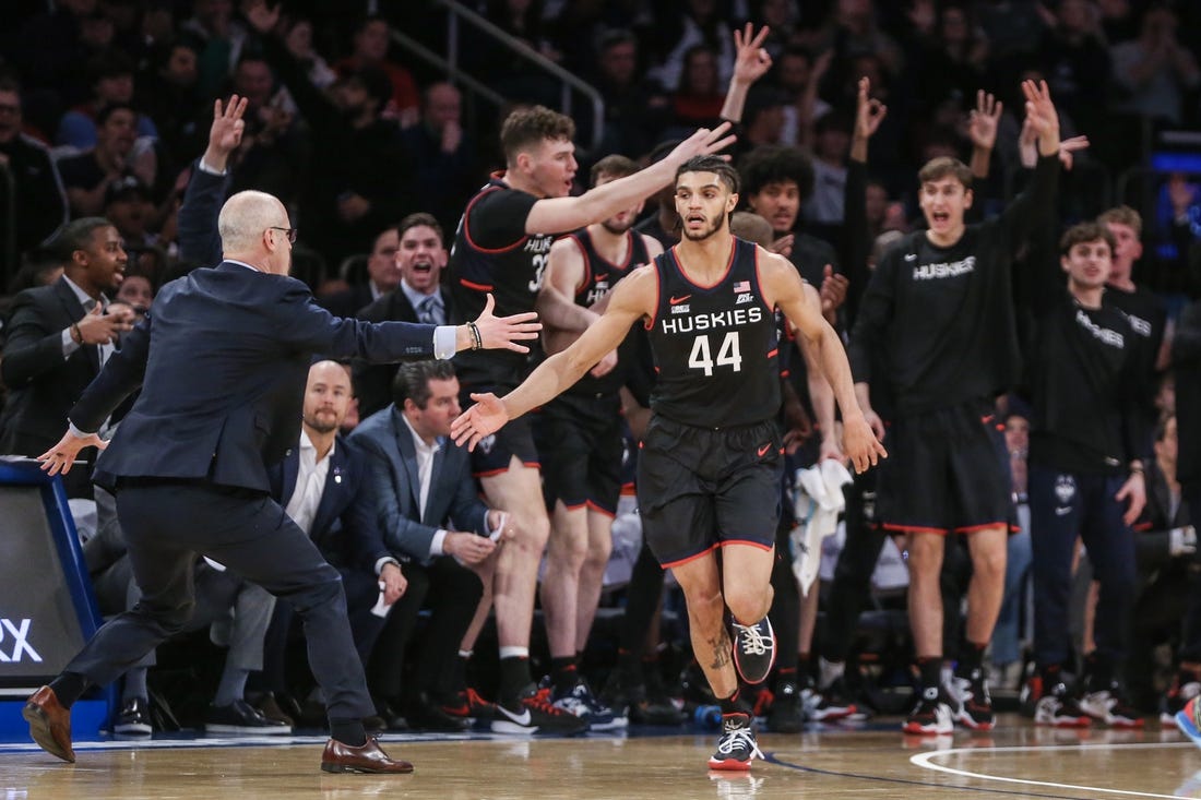 Feb 25, 2023; New York, New York, USA;  Connecticut Huskies guard Andre Jackson Jr. (44) celebrates with head coach Dan Hurley after making a three point shot against the St. John's Red Storm in the second half at Madison Square Garden. Mandatory Credit: Wendell Cruz-USA TODAY Sports