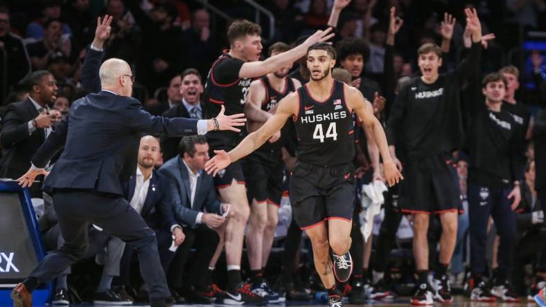 Feb 25, 2023; New York, New York, USA;  Connecticut Huskies guard Andre Jackson Jr. (44) celebrates with head coach Dan Hurley after making a three point shot against the St. John's Red Storm in the second half at Madison Square Garden. Mandatory Credit: Wendell Cruz-USA TODAY Sports