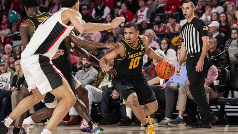 Feb 25, 2023; Athens, Georgia, USA; Missouri Tigers guard Nick Honor (10) dribbles against the Georgia Bulldogs during the first half at Stegeman Coliseum. Mandatory Credit: Dale Zanine-USA TODAY Sports