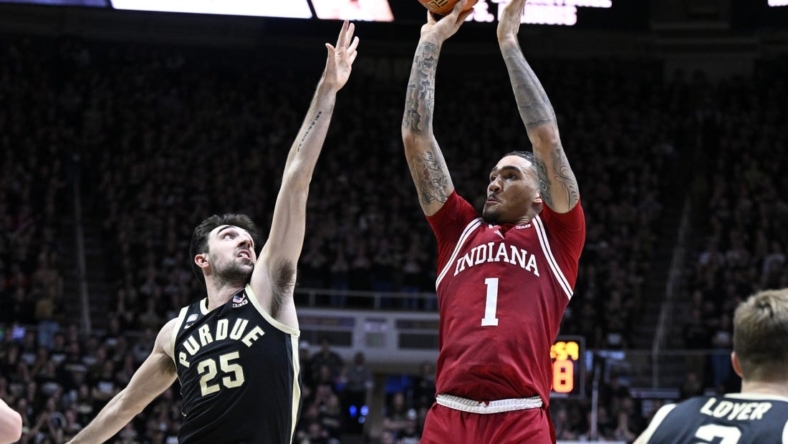 Feb 25, 2023; West Lafayette, Indiana, USA; Indiana Hoosiers guard Jalen Hood-Schifino (1) shoots the ball against Purdue Boilermakers guard Ethan Morton (25) during the first half at Mackey Arena. Mandatory Credit: Marc Lebryk-USA TODAY Sports