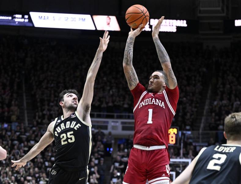 Feb 25, 2023; West Lafayette, Indiana, USA; Indiana Hoosiers guard Jalen Hood-Schifino (1) shoots the ball against Purdue Boilermakers guard Ethan Morton (25) during the first half at Mackey Arena. Mandatory Credit: Marc Lebryk-USA TODAY Sports