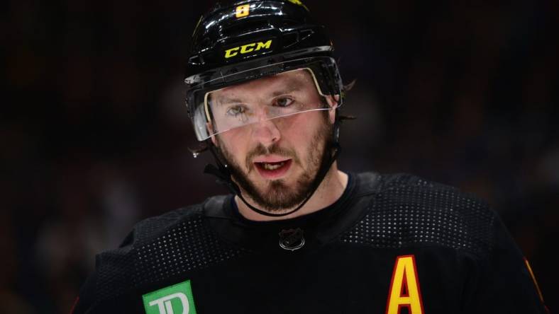 Feb 25, 2023; Vancouver, British Columbia, CAN; Vancouver Canucks forward J.T. Miller (9) awaits the start of play against the Boston Bruins during the second period at Rogers Arena. Mandatory Credit: Anne-Marie Sorvin-USA TODAY Sports